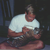 Brian Gisi feeding tiger cub