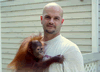 Brian Gisi training baby orangutan